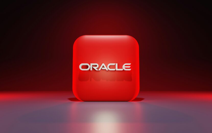 Oracle (ORCL) Stock Soars on AI-Fueled Growth Red cube with "ORACLE" in bold white font, set against a dark gradient background. The glowing effect creates a modern, tech-inspired feel.