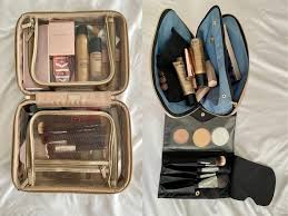 🧳 Your Ultimate Makeup Packing List: Travel Light, Look Flawless Two makeup bags on a bed: one beige with visible compartments holding cosmetics, the other black with open flaps showing brushes and palettes.