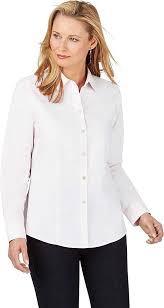 Women's White Button-Down Shirt: The Ultimate Wardrobe Hero A person wearing a crisp white button-up shirt and black pants, standing against a white background. They have a calm, neutral expression.